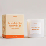 Candle and packaging of 'brunch in the west village' by Literie on a light gray background