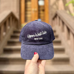 Navy blue cap with 'Upper West Side New York'.
