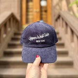 Navy blue cap with 'Upper West Side New York'.