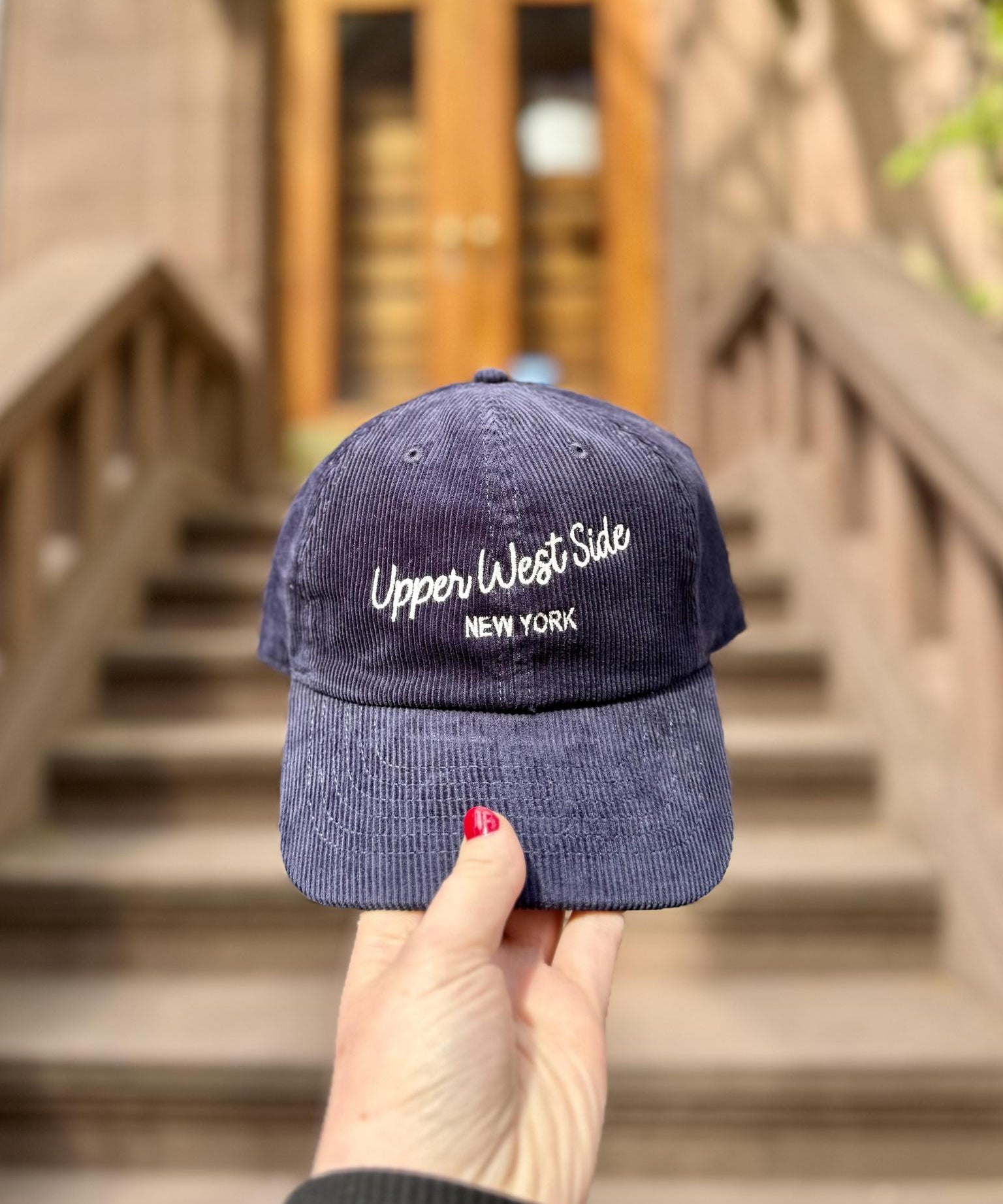 Navy blue cap with 'Upper West Side New York'.